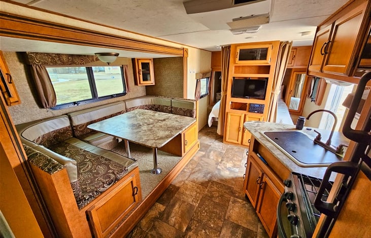 Kitchen and dining table that transforms into a bed