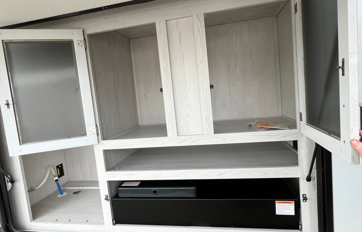 Storage with outdoor kitchen, pull out range.