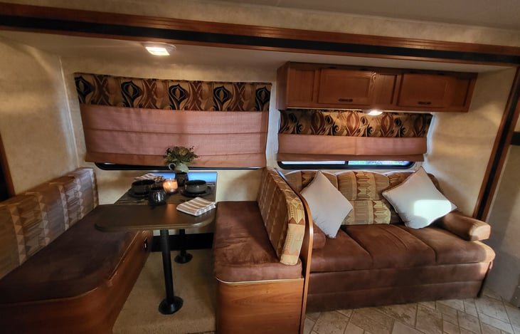 each dinette seat lifts up to access large storage areas