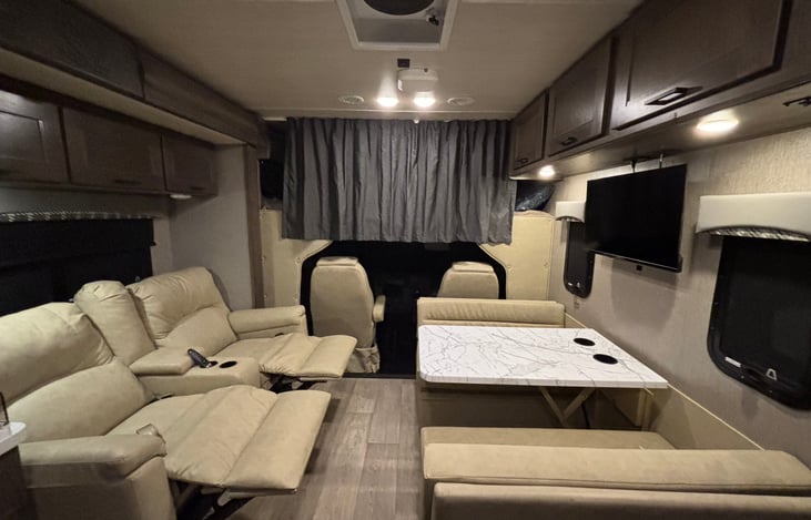 Living Area with 6 Seatbelts can sleep 7 in this area features theater seating and a 40" tv
