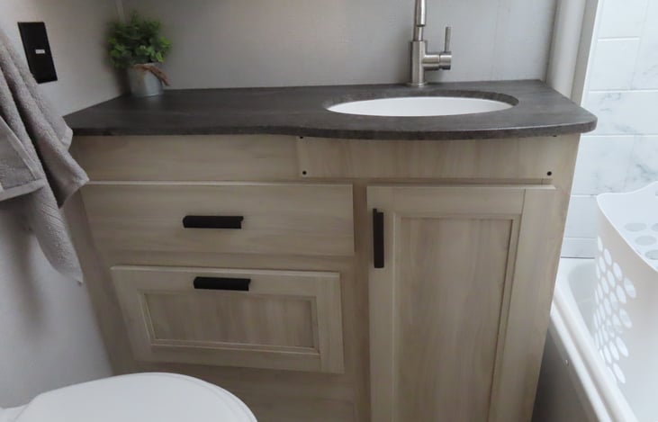 Stocked bathroom includes towels, washcloths, dirty clothes hamper, cleaners, first aid kit and more.