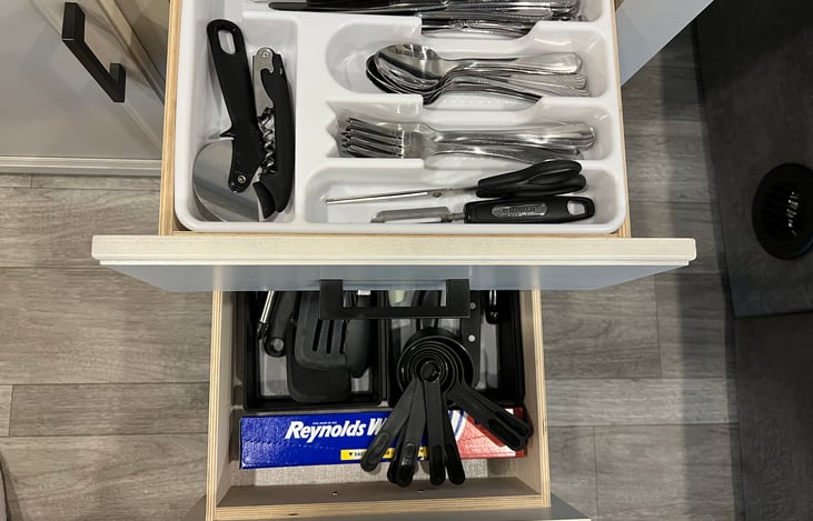 Kitchen utensils and cutlery for 8 are provided.