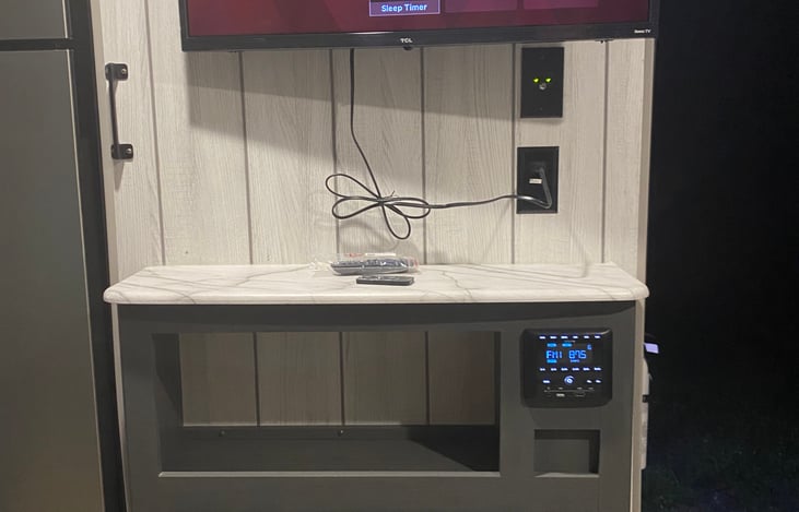 Smart TV in the main area ready to hook up to a gaming system or hot spot into your Netflix account during downtime.