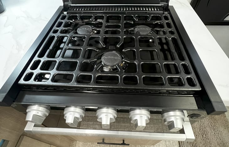 3 burner stove with oven.  We made some great pizza in the oven.