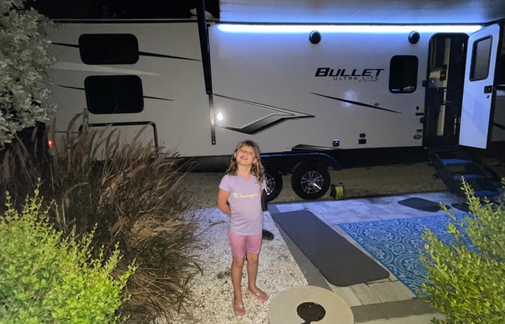 Outdoor kitchen on far left under windows. Open to see mini fridge, pull out stove top (propane). LED lights change colors with remote. Indoor/outdoor Bluetooth stereo system. Additional plug for tv