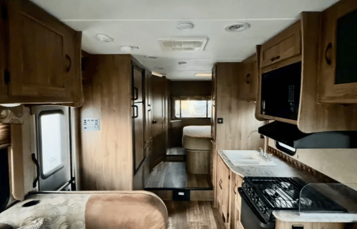 Kitchen with stove, oven and microwave, refrigerator, freezer and private queen bedroom area (electric slide out).