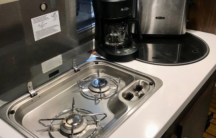 2 burner stove with coffee maker and toaster plugged into kitchen outlets (add-ons)