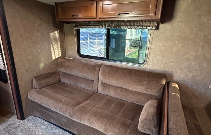 Comfy couch turns into a bed to fit 1 adult, storage available under the couch.