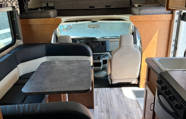 Dinette with seat belts that turns into a bed