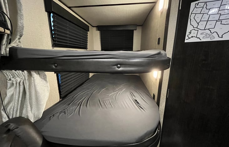 Full size bunk beds each with reading lights and USB outlets.