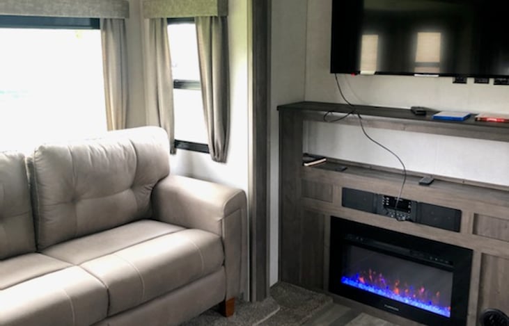 Couch fold out to a bed.  Fireplace gives off heat.  Smart TV for streaming