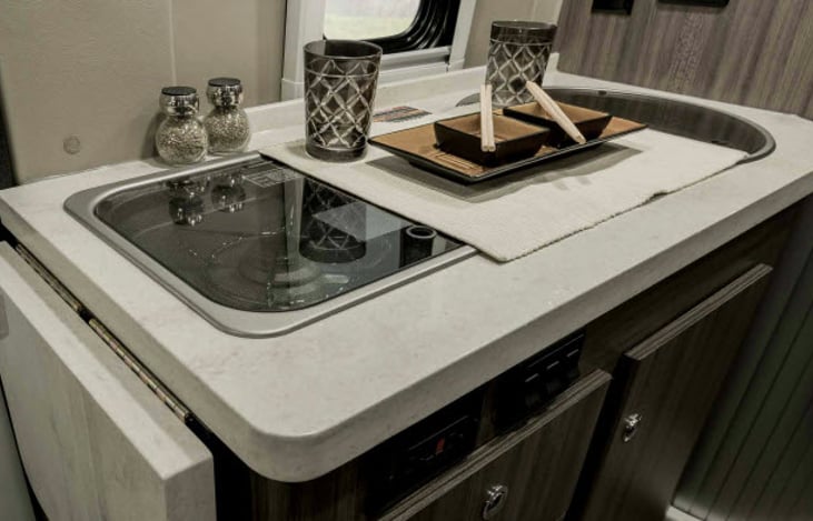 This is the kitchen area. It as additional flip up counter to add additional space to your cooking area to prepare food.