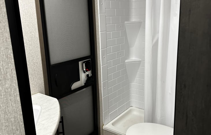 Nice size shower , door also leads outside