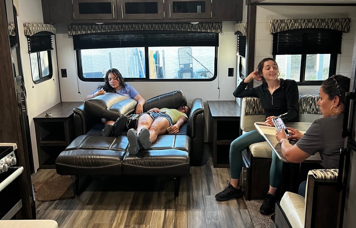 Pull out sofa bed for two more people. It can be used as a sofa throughout the day to seat 2 people.  There are 3 small cabinets for storage above it with a great view to the smart tv.