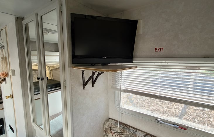 TV with Roku and pop up shelf