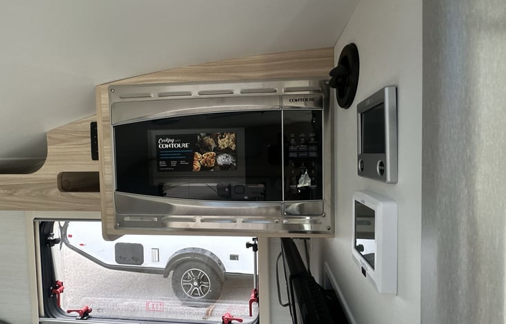 The microwave can cook up popcorn and various tasty meals and snacks when hooked to shore power.