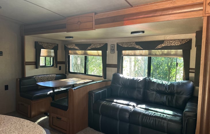 This whole things slides out for much more room. Couch folds into a full size bed, table can turn into a bed as well.