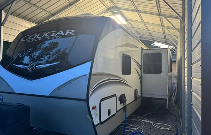 Back side includes water hookups and storage.