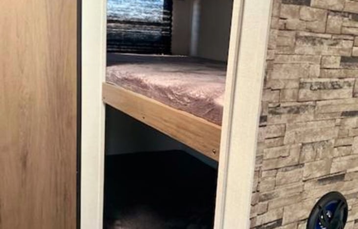 Bigger than twin size bunks with a 3in foam mattress underneath. I do provide sheets if requested.  We live in a crazy time and some prefer to bring their own bedding. Sheets are washed in hot water.