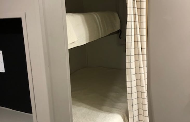 Single bed on top and twin bed on bottom.