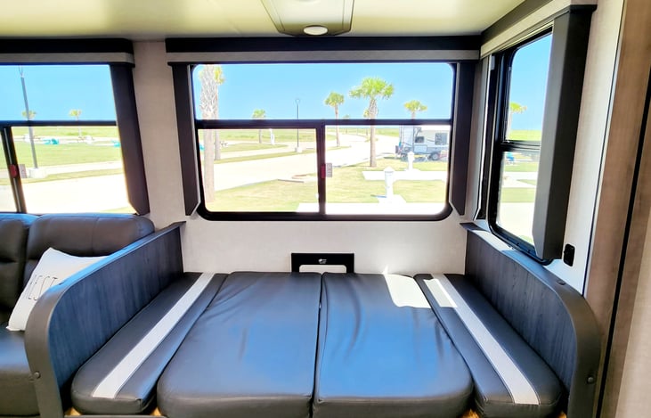The dinette converted into a lounge area or sleep are for littles.