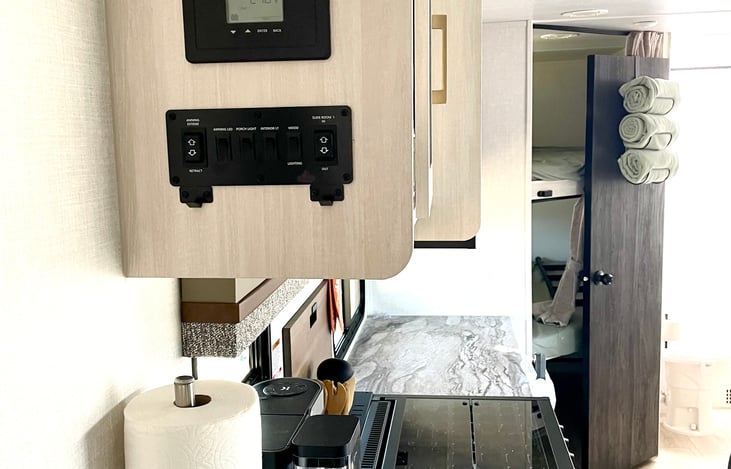 Controls for awning & sliding the dinette and fridge in or out. If moving trailer with prior authorization from us you will need to safely use the slide in controls.