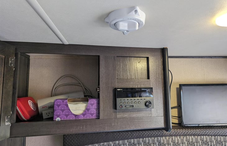 First aid, radio/cd player, TV that can be attached to a phone, laptop, or streaming device.