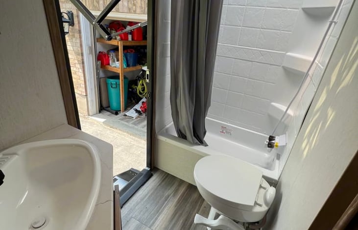 Secondary entrance straight into the bathroom. Awesome for keeping the AC in, and the dirt out!