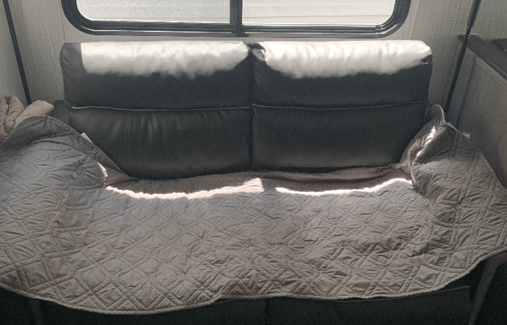 Couch - folds out into a comfortable bed for 1 adult or two children