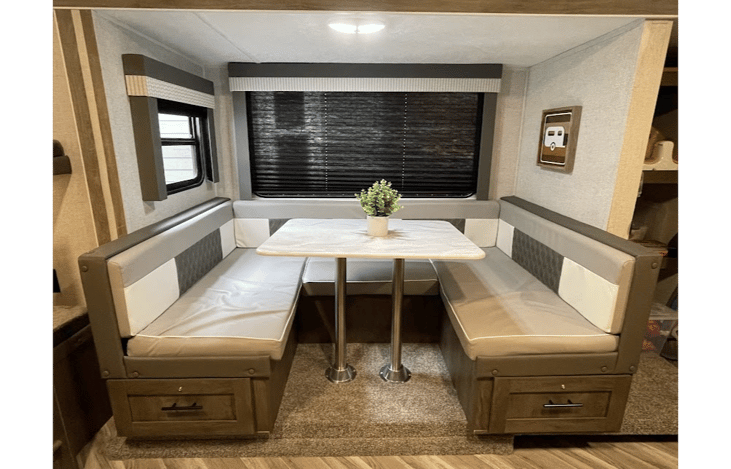 Large Booth Style Dining Area.  Converts To a Bed!