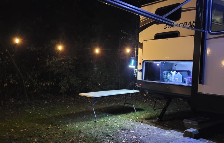 Outdoor kitchen with fridge and griddle