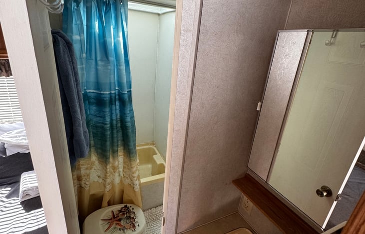 Full shower and toilet seat.