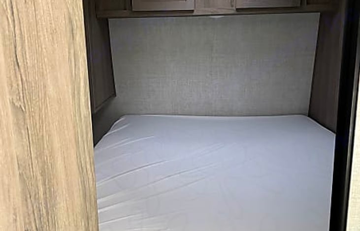 Queen bed in second master bedroom.