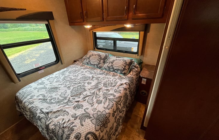 Queen sized master bed with memory foam topper