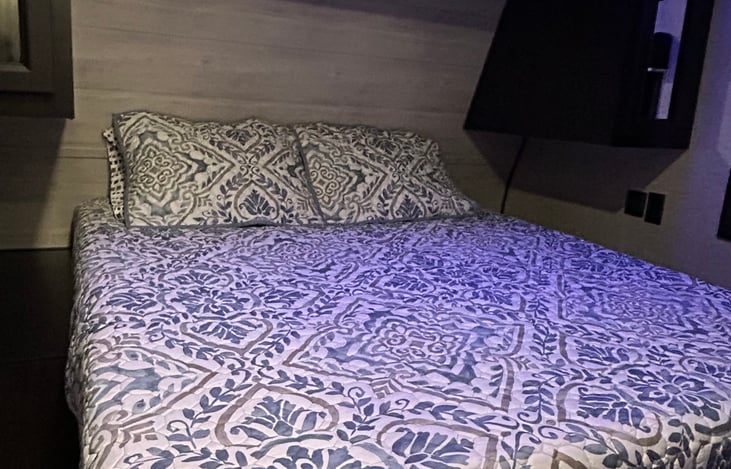 Master bedroom with full walk around, dual wardrobes, floor to ceiling closet with hanging rod and two shelves. Nice night light overhead.