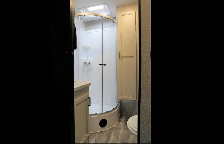 Beautiful bathroom with residential style stand up shower.