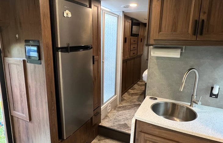 Refrigerator and hall to bedroom