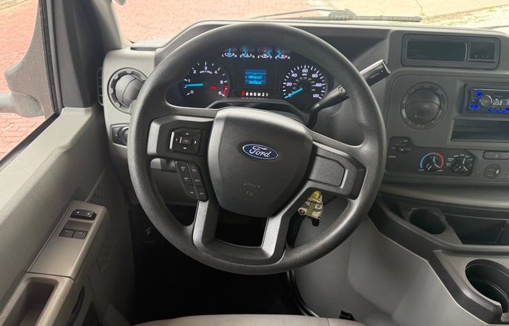 Driver side. Complete with cruise control. Sony radio that has USB hookup. Additional USB C and USB A charging in the cab.