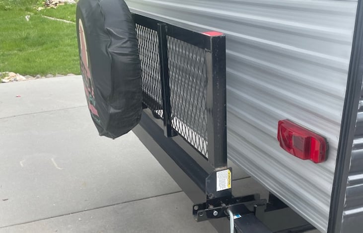 Tailgate style storage rack drops down for extra cargo space.