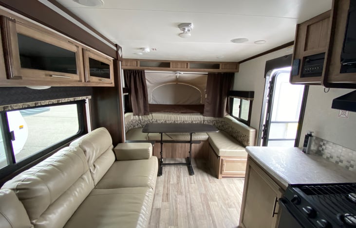 wrap around seating with Dining arrangement, also folds up into a bed