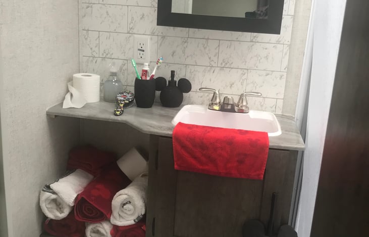 Bathroom with shower and commode.