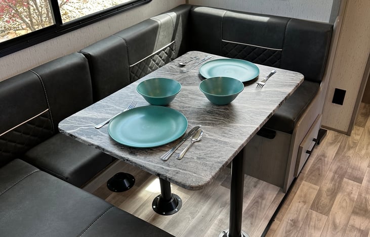 U shaped dinette can be reconfigured to standard booth style or to additional sleeping space.