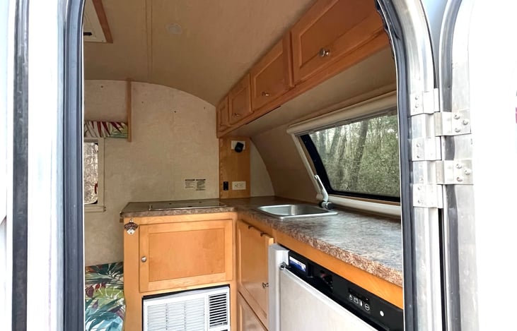 Genius design to have the fridge within easy reach of the doorway, for those times when you want to just grab a cold drink or snack.