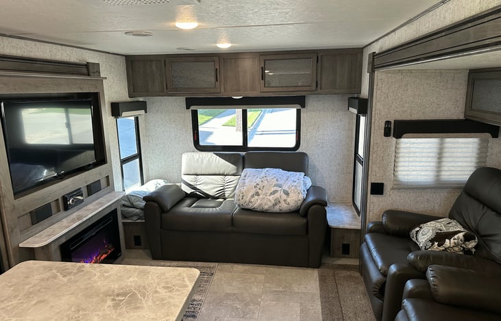 Double slides create roomy living area, with recliner seats directly opposite the TV and fireplace for extreme comfort and ease of viewing.