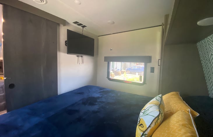 Queen bedroom, two small closets, and smart tv.