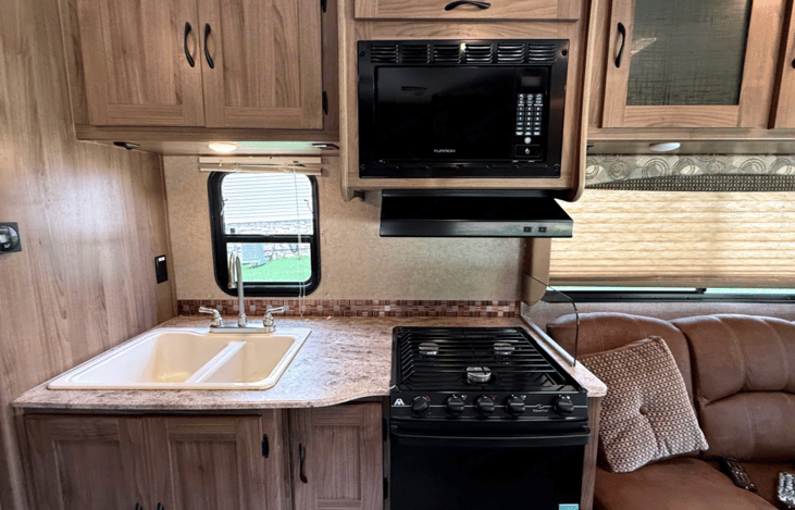 Stove, oven, microwave and sink for outdoor cooking.