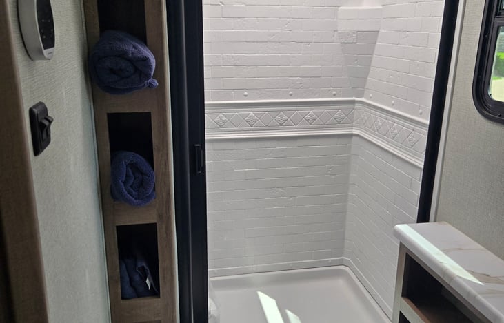 Walk-in shower with on-demand hot water