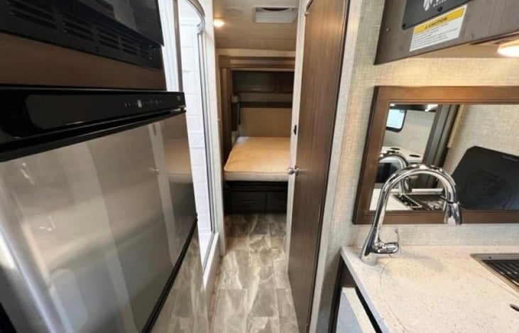 Kitchen area is between the living and dining spaces, and the primary bedroom with full bathroom.