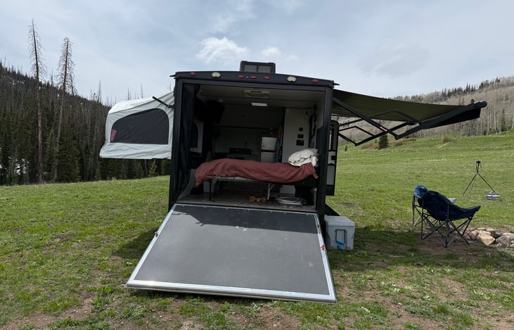 when you open up the back with the bed down, has a heavy-duty screen to enjoy a breeze without the bugs.  With bed up you can load any number of toys or accessories