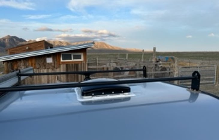 Roof rack and vent with fan